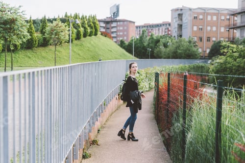 Preview: Young woman walking outdoor