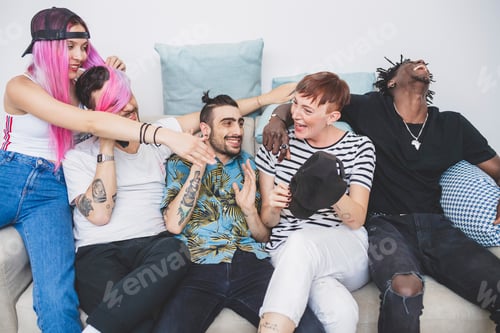 Preview: Friends laughing together on a cozy sofa