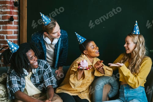 Preview: diversity and international group of young people friends students celebrate a birthday with a cake