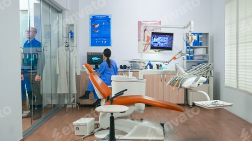 Preview: Nurse inviting next patient in stomatology room