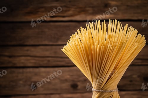 Preview: A bunch of spaghetti dry tied with a rope.