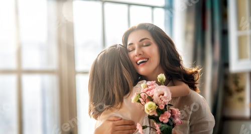 Preview: Daughter giving mother bouquet of flowers.
