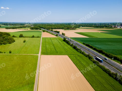 Preview: Farmland from above. Aerial view over green fields