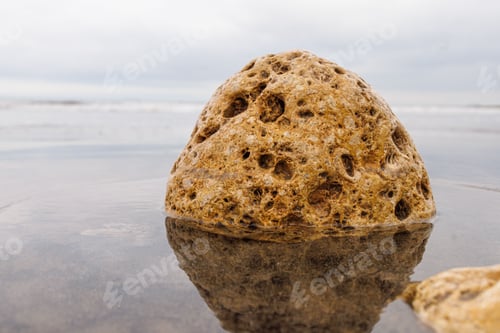Preview: Closeup shot of a giant rock in a water