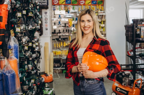 Preview: happy female customer shopping in hardware store.