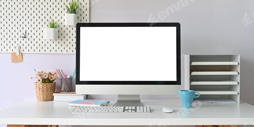 Preview: Computer monitor with white blank screen putting on white working desk.