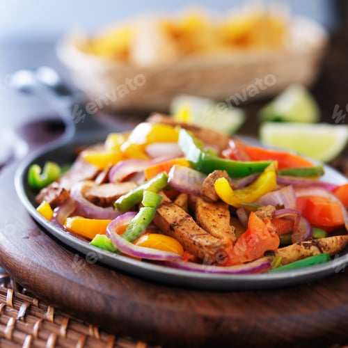 Preview: mexican chicken fajitas in iron skillet with peppers