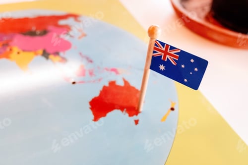 Preview: An Australian flag pinned to a Montessori map of Oceania continent in a school.