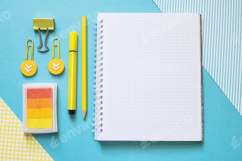 Preview: School supplies. Yellow and blue colors. Empty notebook. Flat lay composition. Space for text.
