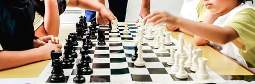 Preview: Children play chess game at school classroom learning education strategy focus