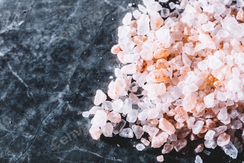 Preview: Grains of Himalayan salt on marble background.