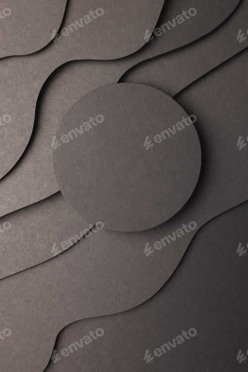 Preview: Vertical image of circle of black paper with copy space on black waves of paper on black background