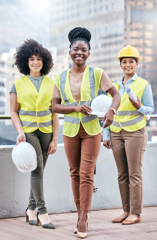 Preview: Portrait of a group of confident young businesswomen working at a construction site