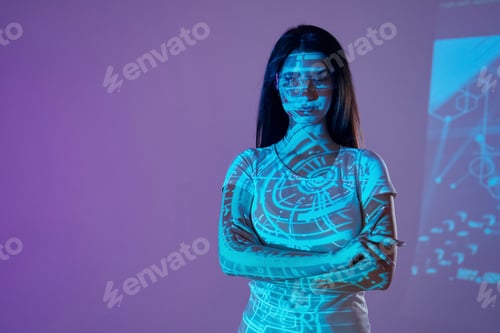 Preview: Abstract picture. Beautiful young woman is in projector neon lights in the studio