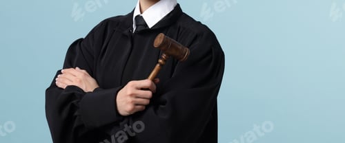 Preview: Judge with mallet on light blue background, closeup