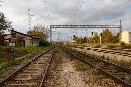 Preview: Wide-angle lens shot of a train track under a cloudy sky