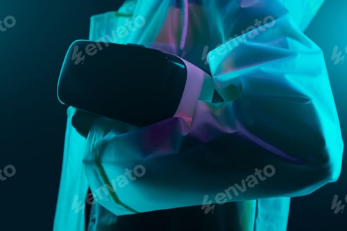 Preview: Crop gamer carrying VR helmet