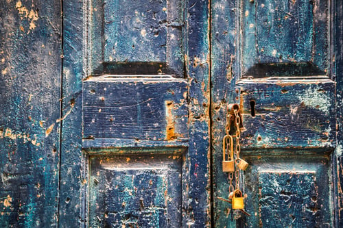 Preview: Old wooden blue door with padlocks