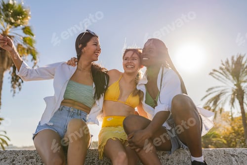 Preview: Three Women Enjoying a Sunny Day at the Beach