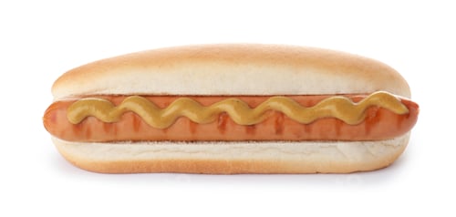 Preview: Tasty hot dog with mustard on white background