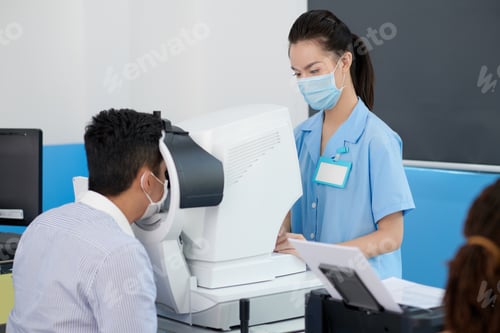 Preview: Patient getting eyes checked with refractometer to get prescription for glasses or contact lenses