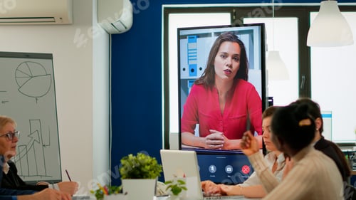 Preview: Multietchincal team listening confident businesswoman webinar speaker coach