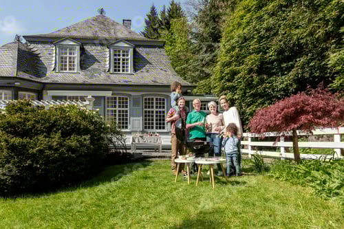 Preview: Happy extended family having a barbecue in garden