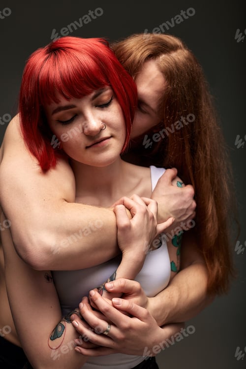 Preview: Close-up studio portrait of a passionate young couple in love embracing. A handsome muscular semi