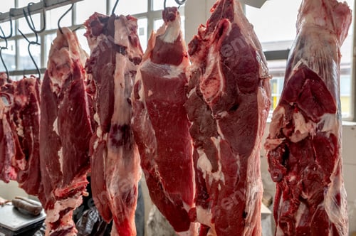Preview: Raw beef hanging at marketplace in meat rawsss