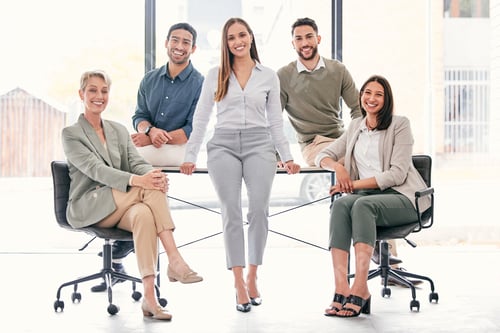 Preview: Full length shot of a diverse group of businesspeople sitting together in the office during the day