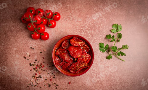 Preview: dried tomatoes, in a bowl, top view, on a brown background,