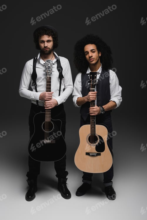 Preview: duet of handsome young musicians with acoustic guitars on black