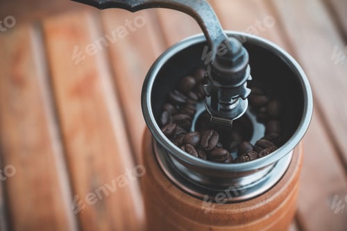 Preview: Closeup image of a vintage wooden coffee grinder