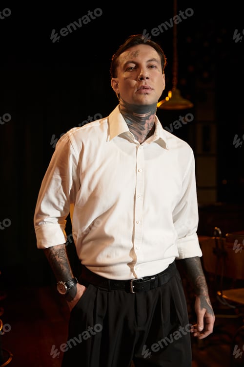 Preview: Stylish young man captures attention during a vibrant nightlife experience at the bar