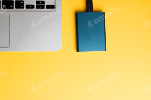 Preview: Closeup of a laptop part and a memory drive