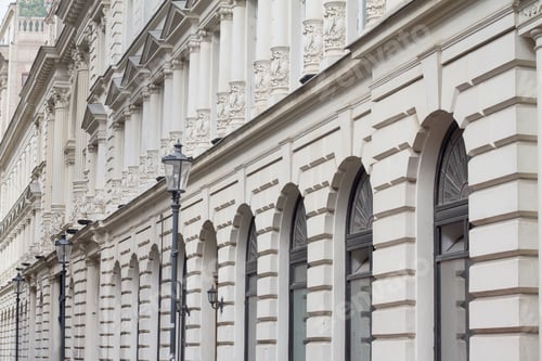 Preview: White, classical building architecture with windows and street l
