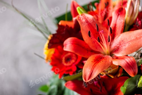 Preview: Vibrant Bouquet of orange Asiatic lilies and other flowers