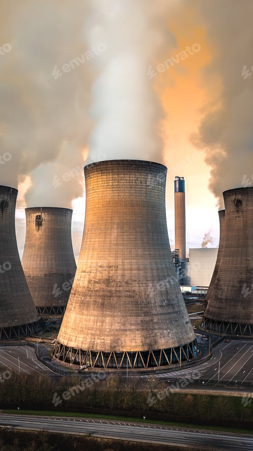 Preview: Vertical aerial view of cooling towers at a power plant with pollution
