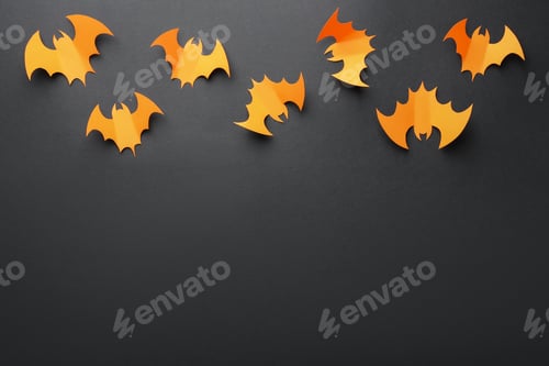 Preview: Halloween decor. Orange paper bats on black background, flat lay. Space for text