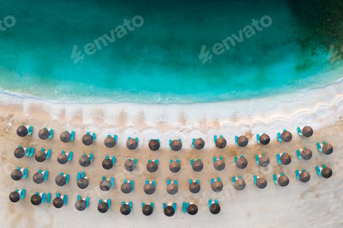Preview: Beach, beautiful waves, blue water at sunrise. Top view from drone.