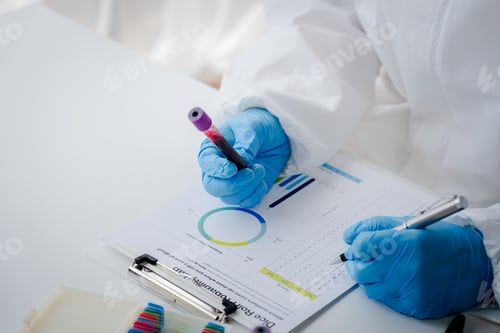 Preview: Doctor or research scientist taking blood sample tube to check data in laboratory biotechnology spec