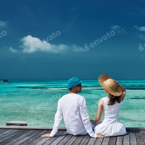 Preview: Couple On A Tropical Beach Jetty At Maldives