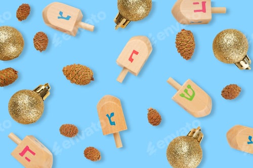 Preview: Hanukkah, dreidels and glitter ornaments with pinecones on blue