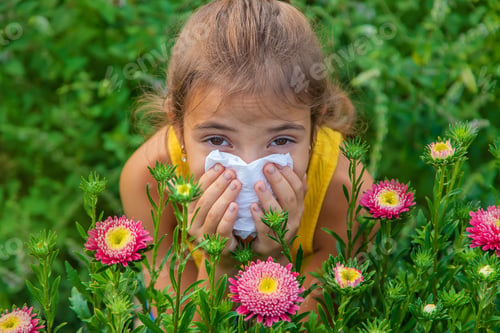 Preview: The child is seasonal allergy to flowers. Selective focus.