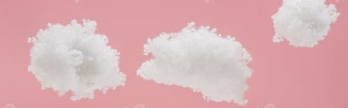 Preview: white fluffy clouds made of cotton wool isolated on pink, panoramic shot