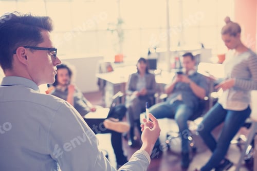Preview: Young Business Team At A Meeting at modern office building