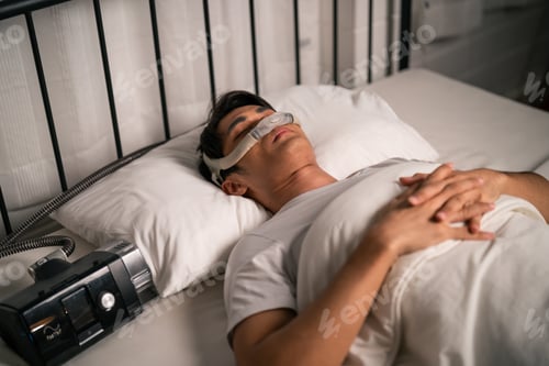 Preview: Asian man wearing cpap machine sleeping smoothly all night in bedroom.