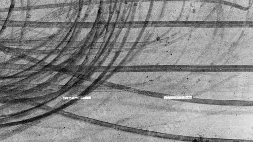Preview: Aerial view tire track mark on asphalt tarmac road race track texture and background.