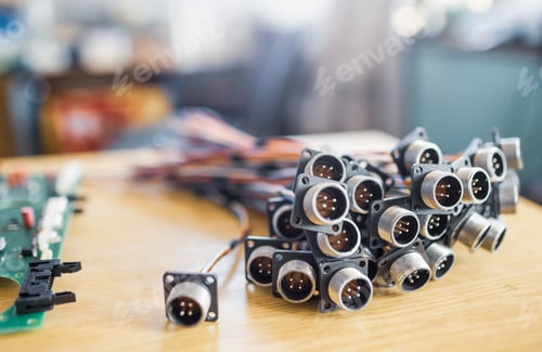 Preview: Close-up blurry metal sockets for plugs are in a heap