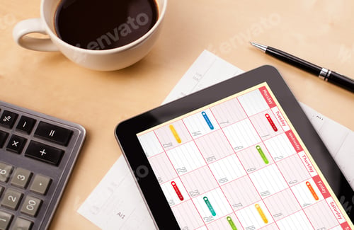 Preview: Workplace With Tablet Pc Showing Calendar And A Cup Of Coffee On A Wooden Work Table Close-Up